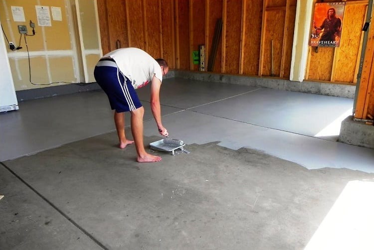Man Repairing Garage Floor